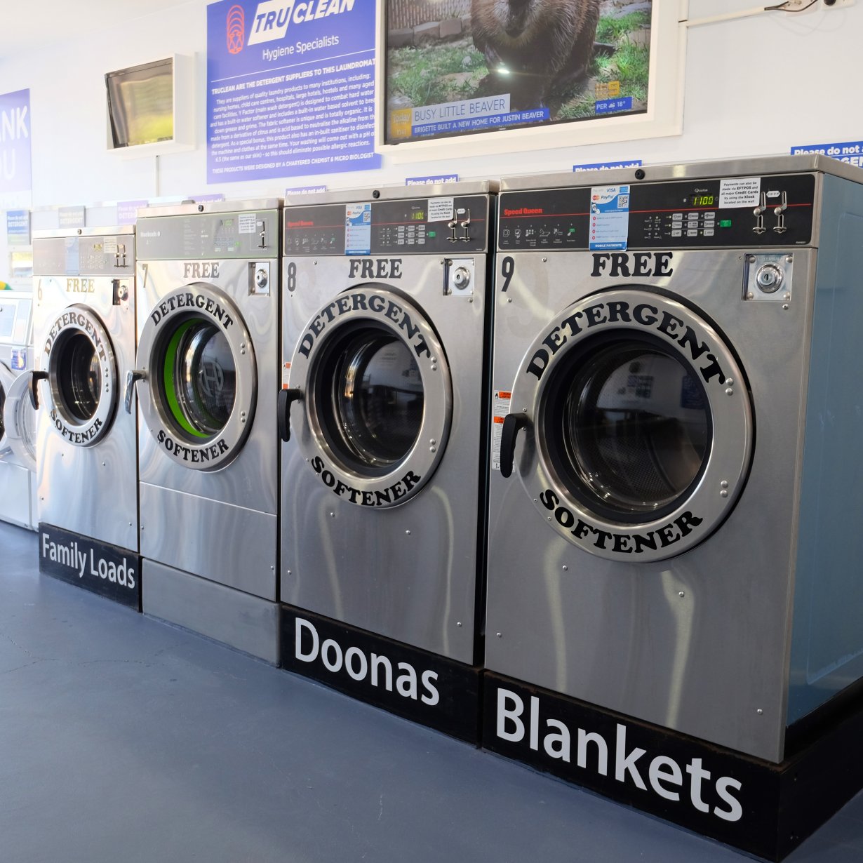 Four washing machines shown from angle
