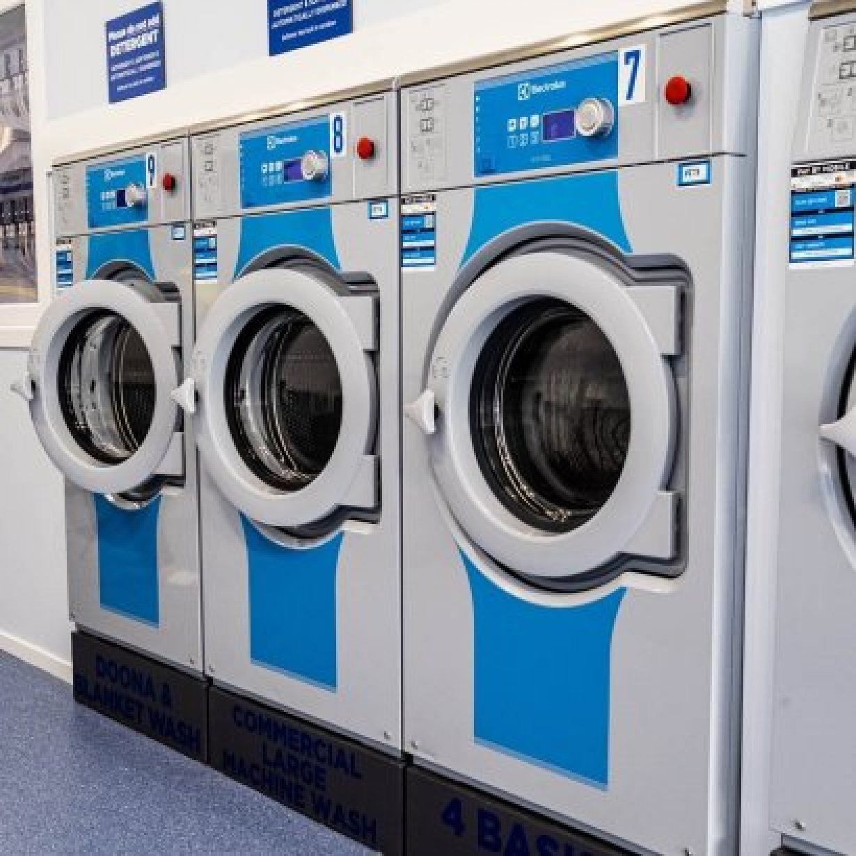 Three large size washing machines from angle