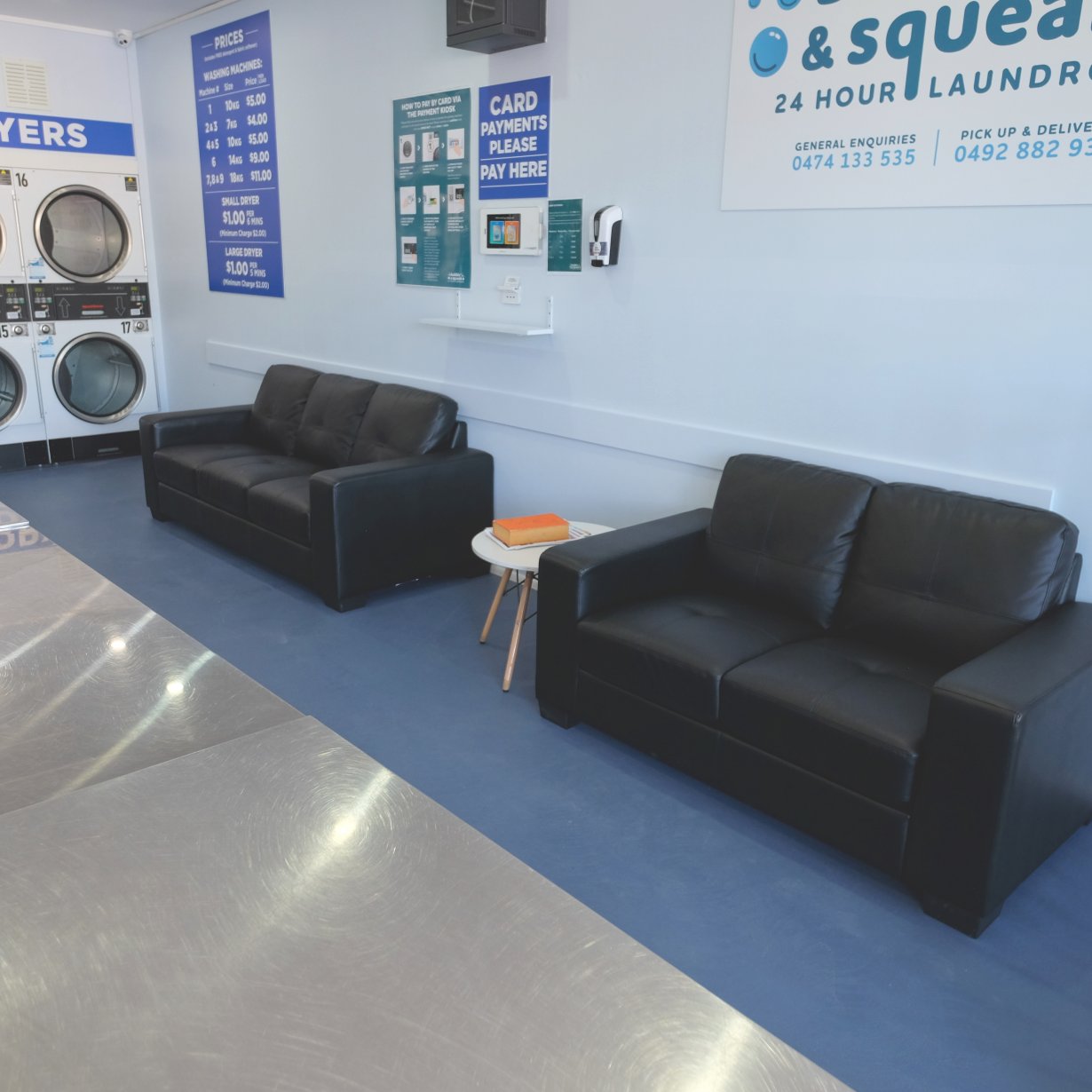 Two black leather sofas